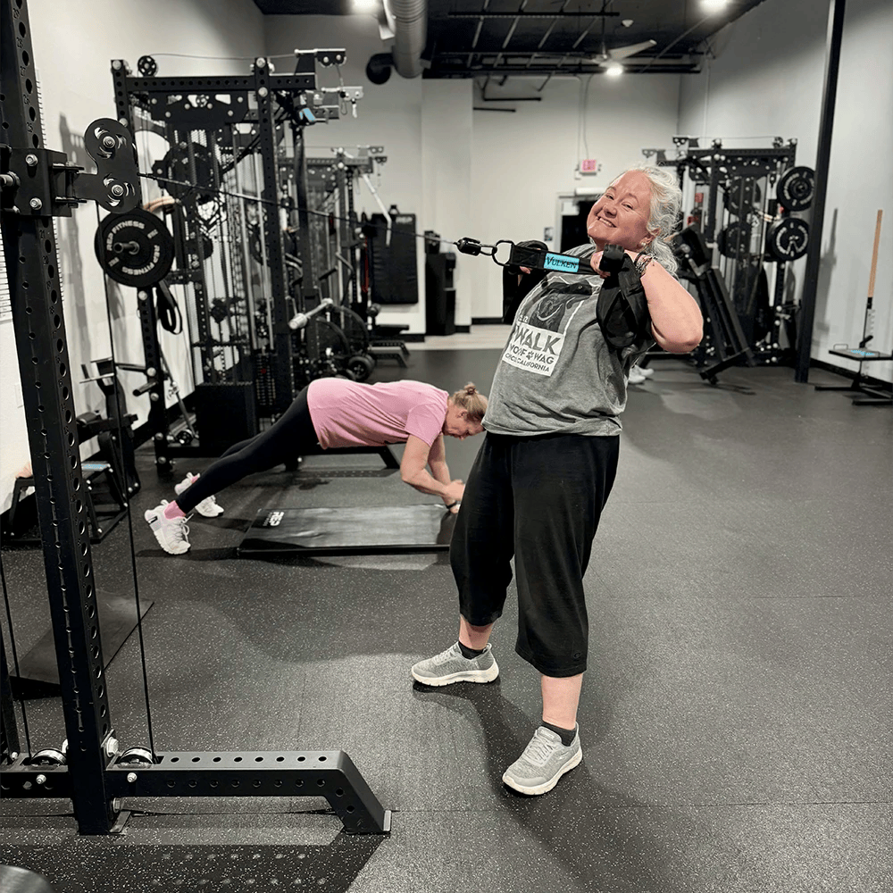 woman smiling while working out at Foundation Fit Chico